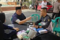Warga saat memeriksakan kesehatan dan dilayani oleh Tim medis dari Bidang Kedokteran dan Kesehatan (Biddokkes) Polda Kepulauan Riau (Kepri). Matapedia6.com/Dok Humas Polda