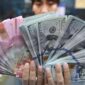 Ilustrasi rupiah dan dolar AS.