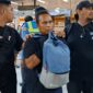 Hermanto alias Gondrong pelaku pembunuhan di kawasan Jodoh saat tiba di Bandara Hang Nadim Kota Batam, Kamis (25/7/2024). Matapedia6.com/ Luci