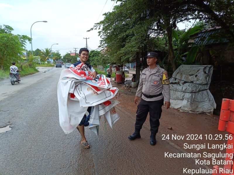Tim gabungan melakukan penertiban alat peraga kampanye di Kota Batam jelang masa tenang Pilkada 2024, Minggu (24/11/2024) Matapedia6.com/Dok Humas Polresta