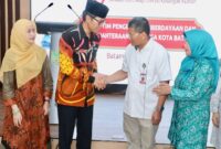 Kepala OJK Kepri Sinar bersama dengan Sekda Batam Firmansyah. Foto:Diskominfo Batam