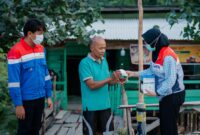Pertamina Patra Niaga Sumbagut bagikan masker kepada warga. Foto:Istimewa